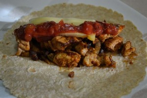 A hot tortilla loaded with Chicken Stinkum, with added salsa and cheese.