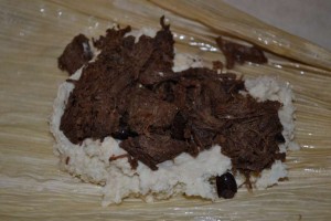 Chilpotle Caribou Flake going into a tamale