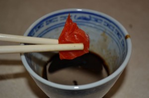 Sashimi dipped in soy and wasabi