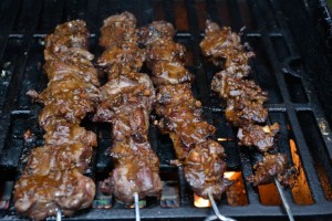 Caribou anticuchos ready to come off of the grill
