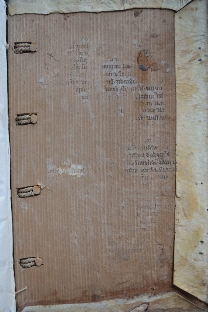 Inside of the rear cover of an incunabulum from 1490, showing ink offset from an older vellum manuscript fragment used in the binding over 500 years ago but since removed.